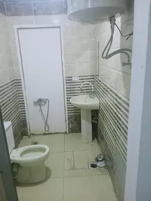 a bathroom with a toilet and a sink at Sheraton Plaza Marina Blast 2 bedroom 2 bathroom in Hurghada