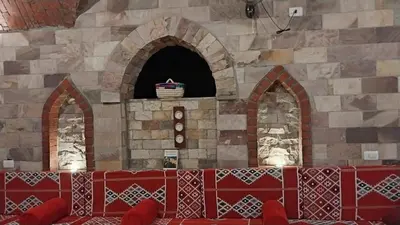 a stone wall with aasteryasteryasteryasteryasteryasteryasteryasteryasteryasteryastery at Shahhat Flat in Luxor