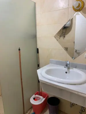 a bathroom with a sink and a mirror at Hurghada Concierge at Turtles Beach Resort in Hurghada