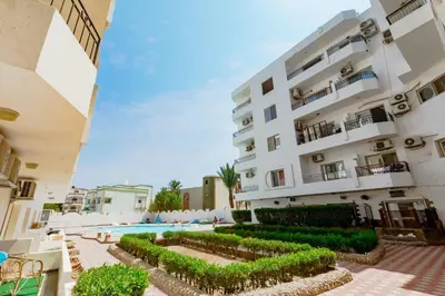 a view of a building with a swimming pool at Al makramia Compound in Hurghada
