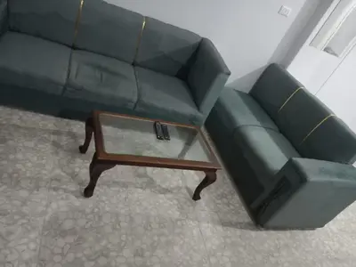 a living room with a couch and a coffee table at Ikea flat 7 in Hurghada