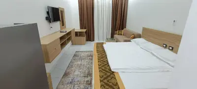 a hotel room with a bed and a tv at Floranza khamsin hurgada منتجع فلورنزا الغردقه in Hurghada