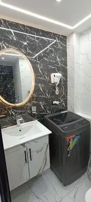 a bathroom with a sink and a mirror and a trash can at Floranza khamsin hurgada منتجع فلورنزا الغردقه in Hurghada