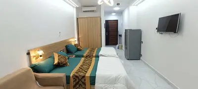 a hotel room with a bed and a couch at Floranza khamsin hurgada منتجع فلورنزا الغردقه in Hurghada