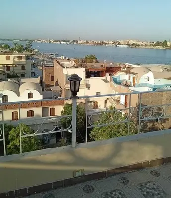 a view of a city with a river and buildings at Nagar Villa For Rent in Luxor