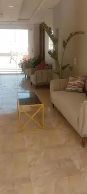 a living room with couches and a coffee table at Perfect for couples, Sunny & SeaView & Free Wi-fi in Hurghada