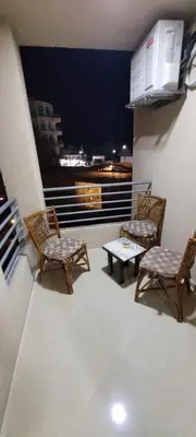 a balcony with two chairs and a table with a view at Perfect for couples, Sunny & SeaView & Free Wi-fi in Hurghada