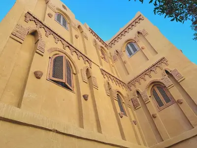 a building with many windows on top of it at Ramses Apartment in Luxor