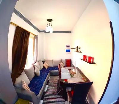 a living room with a couch and a table at hurghada home in Safaga