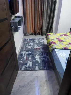 a room with a bed and a rug on the floor at Hurghada City Apartment2 in Hurghada