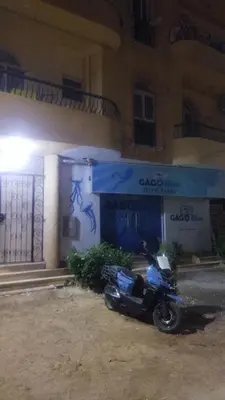 a motorcycle parked in front of a building at Hurghada City Apartment2 in Hurghada