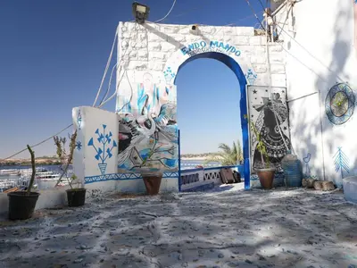 a building with a mural on the side of it at Endo Mando in Shellal