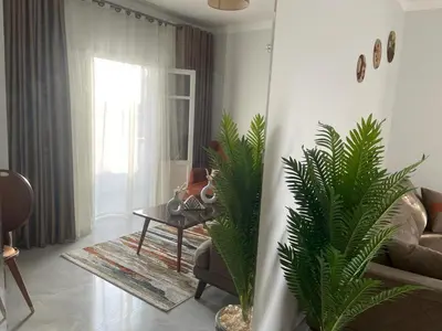 a living room with a couch and a table at Tony HOUSE in Aswan