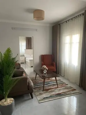 a living room with a couch and a table at Tony HOUSE in Aswan