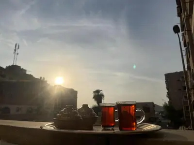 a tray with two cups of tea on a table at Tony HOUSE in Aswan