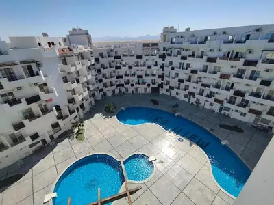 an aerial view of a large apartment complex with two swimming pools at Tiba view in Hurghada