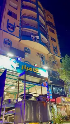 a building with a jumeirah sign in front of it at شقة مميزة بجوار كورنيش النيل اسوان - عائلات فقط in Aswan