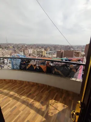 a balcony with a view of a city at شقة مميزة بجوار كورنيش النيل اسوان - عائلات فقط in Aswan