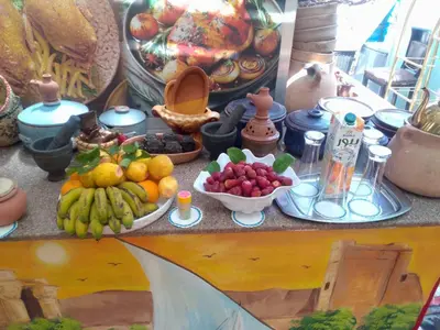 a display of fruits and vegetables on a table at peace garden hostel & camp in Luxor