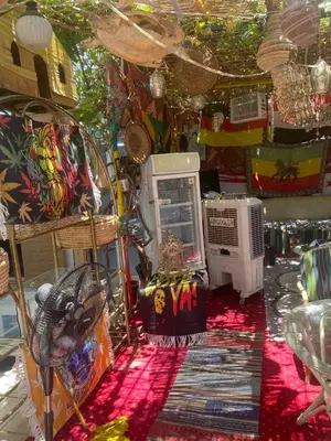 a room with a table and chairs and a room with a table at peace garden hostel & camp in Luxor