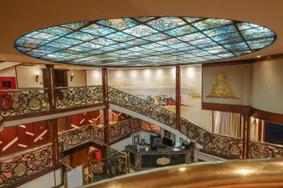 a spiral staircase with a stained glass ceiling at Nile Cruise City and Sea Adonis - Every Thursday from Luxor for 04 or 07 Nights - Every Monday from Aswan for 03 Nights in Luxor