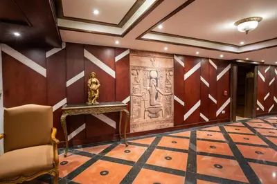 a room with a statue on the wall at Nile Cruise City and Sea Adonis - Every Thursday from Luxor for 04 or 07 Nights - Every Monday from Aswan for 03 Nights in Luxor