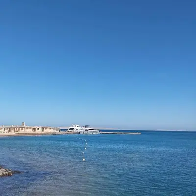a large body of water with buildings in the background at Al-hambra in Hurghada