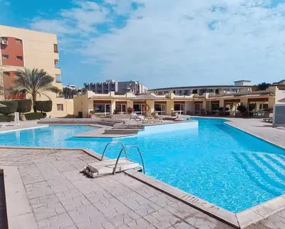 a large swimming pool in front of a building at Al-hambra in Hurghada