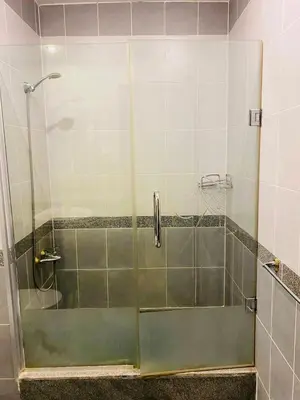 a shower with a glass door in a bathroom at Apartment Sahl Hasheesh 1+1 in Hurghada