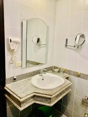 a bathroom with a sink and a mirror at Apartment Sahl Hasheesh 1+1 in Hurghada