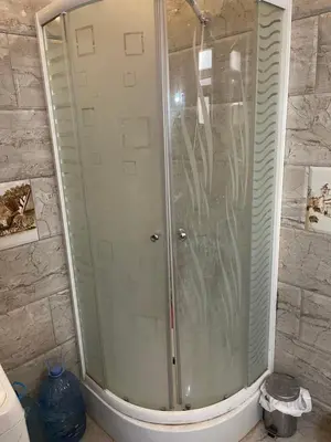 a shower with a glass door in a bathroom at Marvel lotus in Hurghada
