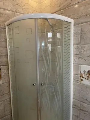 a shower with a glass door in a bathroom at Marvel lotus in Hurghada
