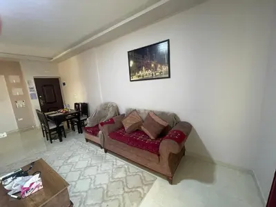 a living room with a couch and a table at Marvel lotus in Hurghada