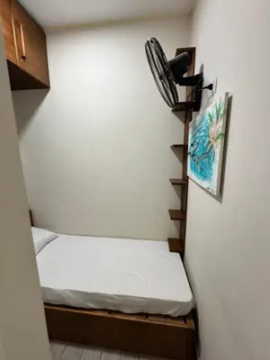 a small room with a bed and a wall at Bali c 3 D in Hurghada