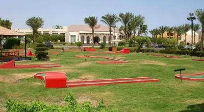 a park with red ramps in the grass at sahl hashesh makadi- hurghada- in Hurghada