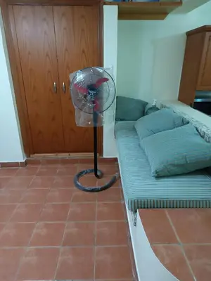 a room with a fan next to a bed at sahl hashesh makadi- hurghada- in Hurghada