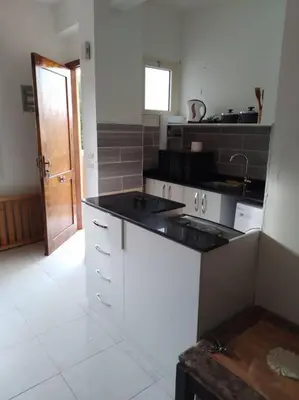 a kitchen with a stove and a counter top at Mountain view apartment in Makadi Heights in Hurghada