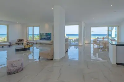 a large living room with a view of the ocean at Royal Villa on the beach in Hurghada