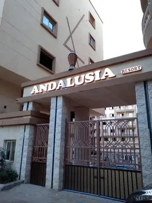 a sign on the front of a building with a gate at Andalusia Resort - 2 Bedroom Apartment in Hurghada
