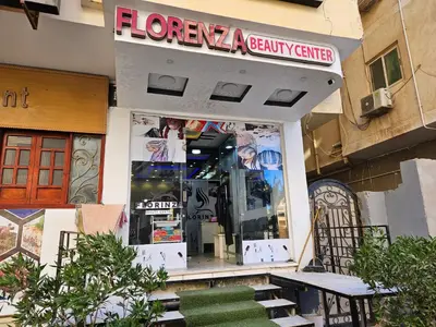 a store with a sign on the front of it at Pool View Studio with Wi-fi, Smart TV, 3 pools & beach access in Hurghada