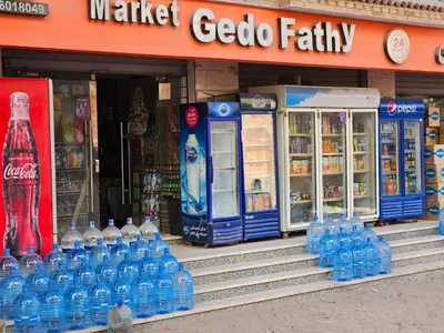 a store with a bunch of bottles of water at Pool View Studio with Wi-fi, Smart TV, 3 pools & beach access in Hurghada