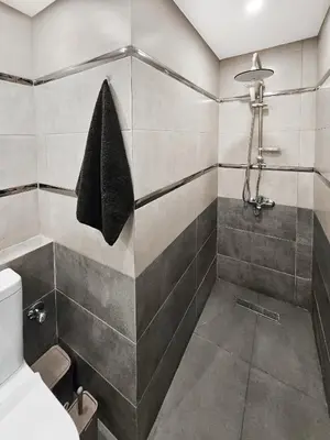 a bathroom with a shower and a toilet at Pool View Studio with Wi-fi, Smart TV, 3 pools & beach access in Hurghada