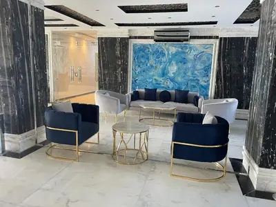 a lobby with couches and chairs and a table at Juliana Beach Resort Hurghada in Hurghada