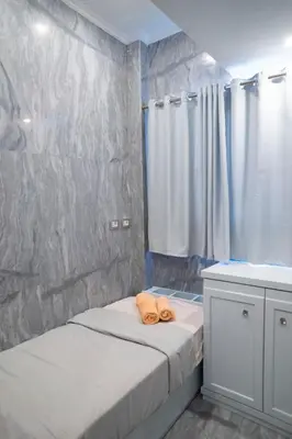 a small bedroom with two beds and a sink at MB1-1-104 in Hurghada