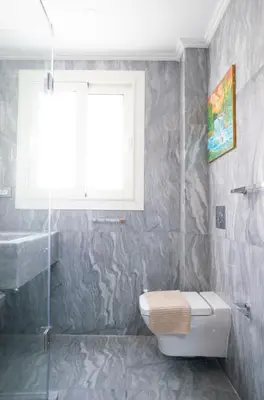 a bathroom with a toilet and a window at MB1-1-104 in Hurghada