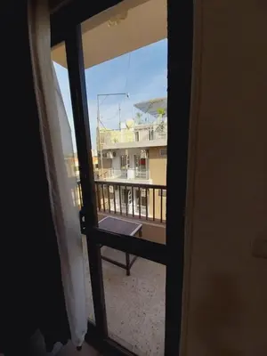 a view of a balcony from a window at Merry Land Hotel & Roof Top Nile Restaurant Luxor in Luxor