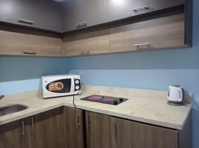 a kitchen with a microwave sitting on a counter at Fanadir bay in Hurghada