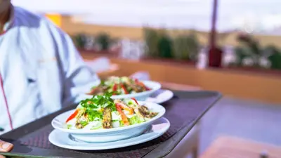 a table with three plates of food on it at Lazur Sea & City Apartment's - El Hadaba, Hurghada - Egypt in Hurghada
