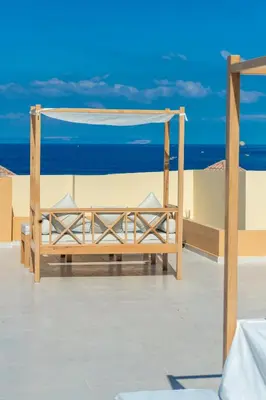 a hammock on a roof with the ocean in the background at Lazur Sea & City Apartment's - El Hadaba, Hurghada - Egypt in Hurghada
