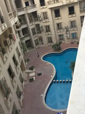 an overhead view of a swimming pool in a building at Studio Cleopatra Resort in Hurghada